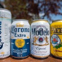 4 cans of Mexican beers; Corona Premier, Corona Extra, Modelo, and Pacifico