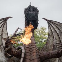 large metal dragon sculpture breathing fire during Wyandotte's Fire & Flannel Festival