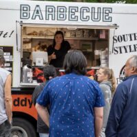 Southern Style Barbecue food truck with crowd in line