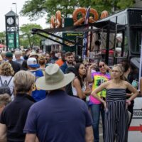 food trucks and large crowd at Swiggin' Pig event
